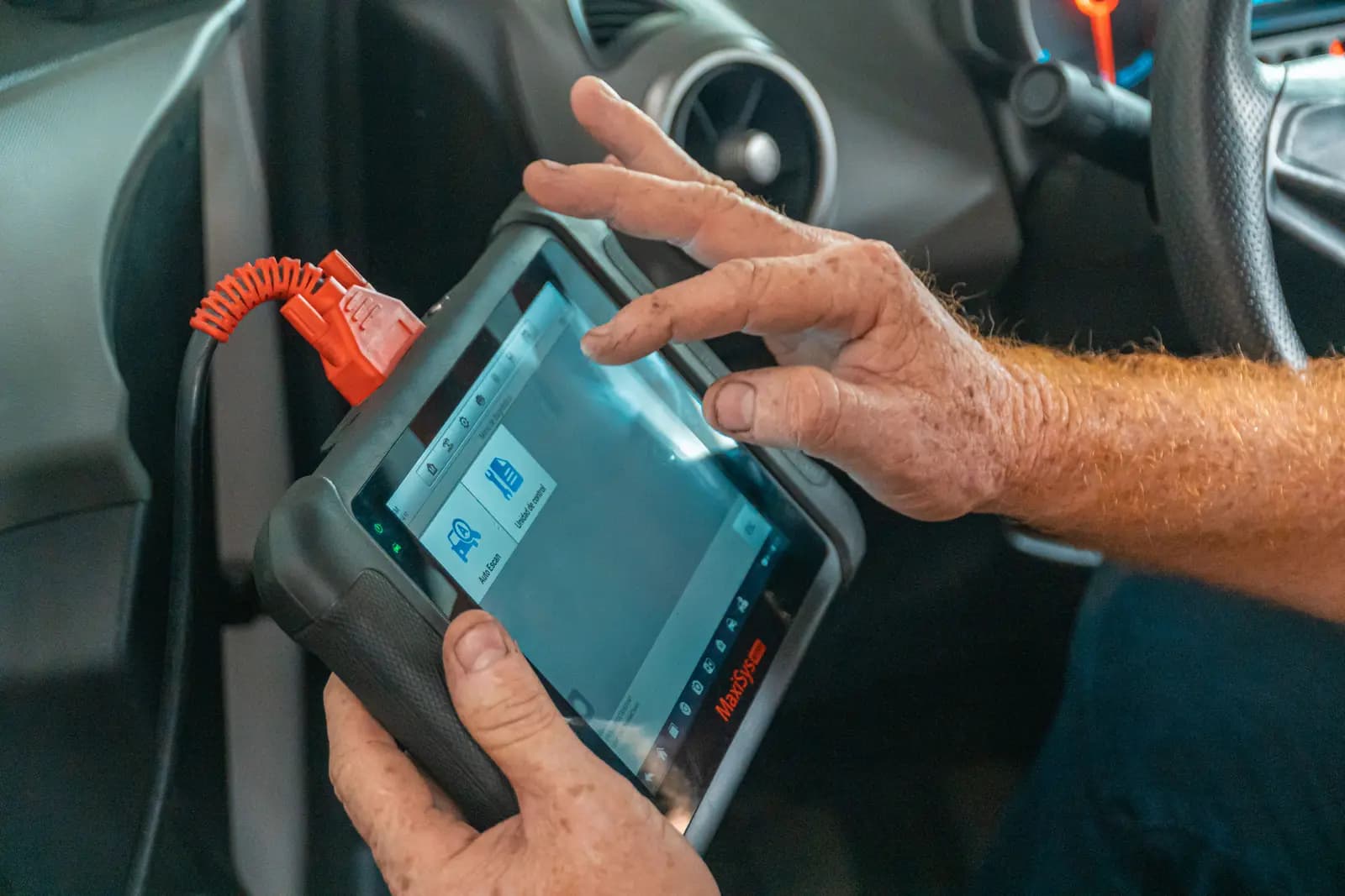 Diagnostic tool plugged into a car