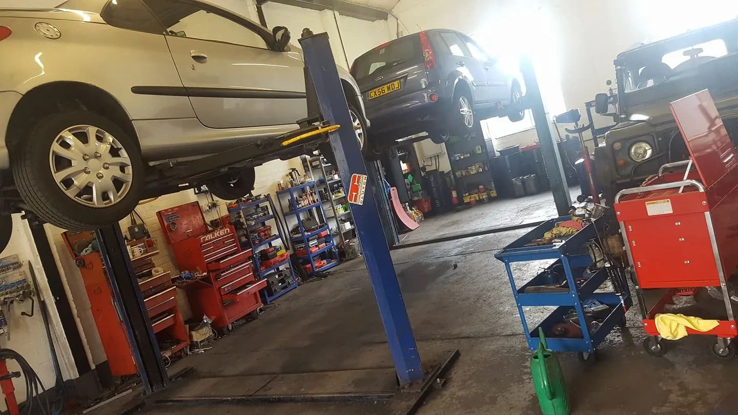 Cars up on the lifts inside the TAS workshop